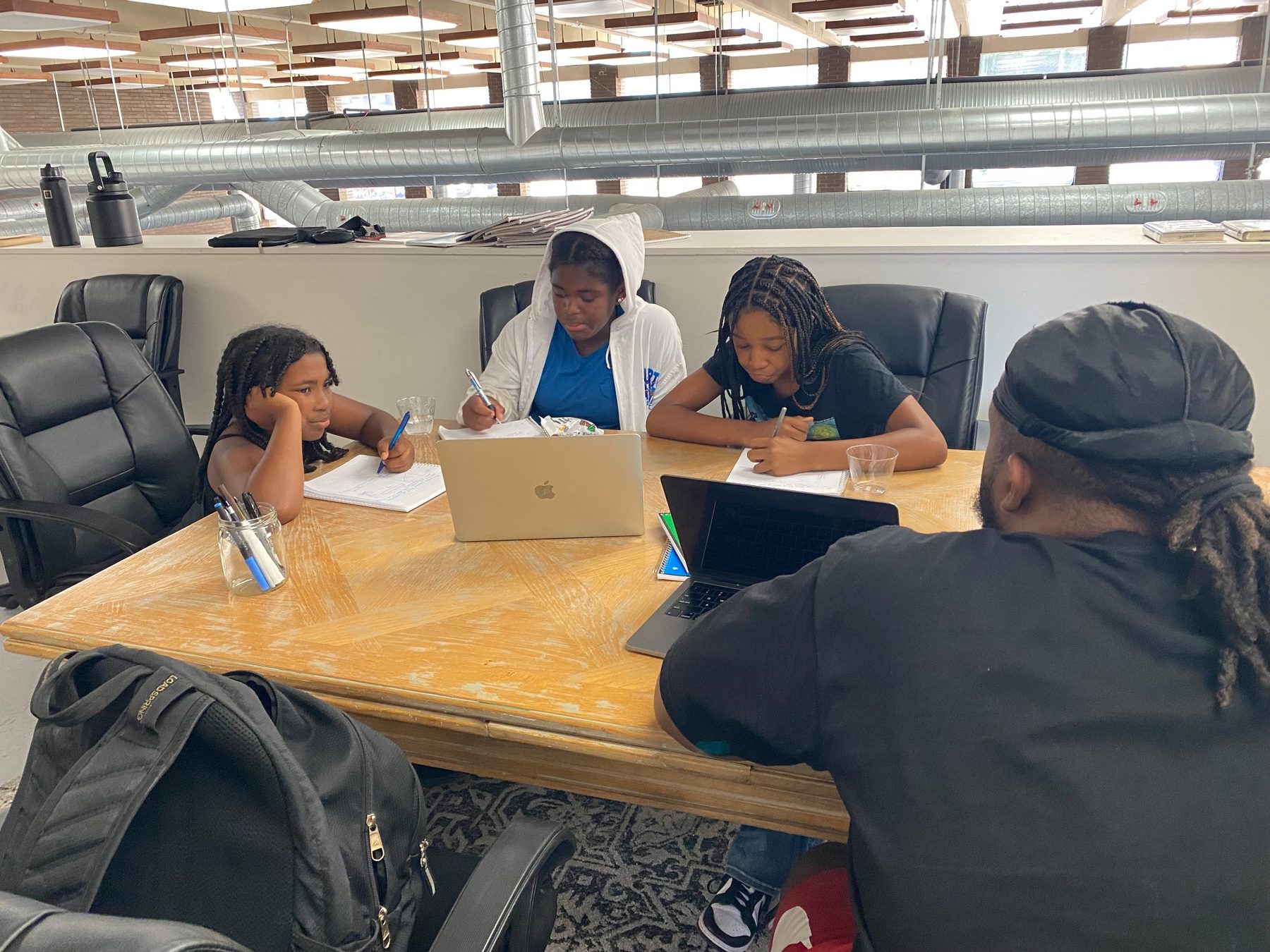 Students learning together in community
